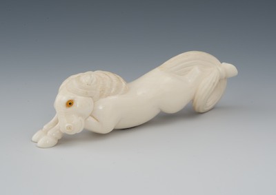 A Carved Ivory Netsuke of a