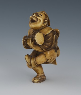 A Carved Ivory Netsuke of a