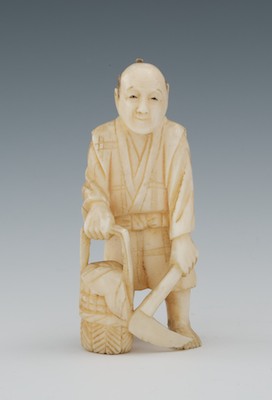 A Carved Ivory Netsuke of a