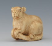 A Carved Ivory Netsuke of a Ra