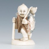 A Carved Ivory Netsuke of a Tr