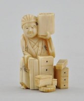 A Carved Ivory Okimono Carved