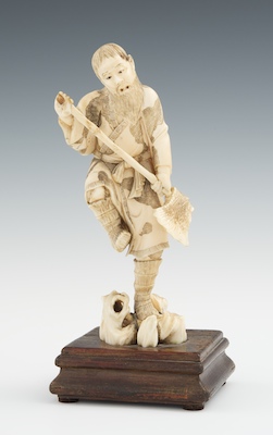 A Carved Ivory Okimono of a Man