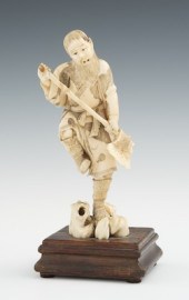 A Carved Ivory Okimono of a Ma