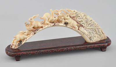 A Carved Ivory Ornament of Rabbits,