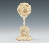 A Carved Ivory Puzzle Ball Car