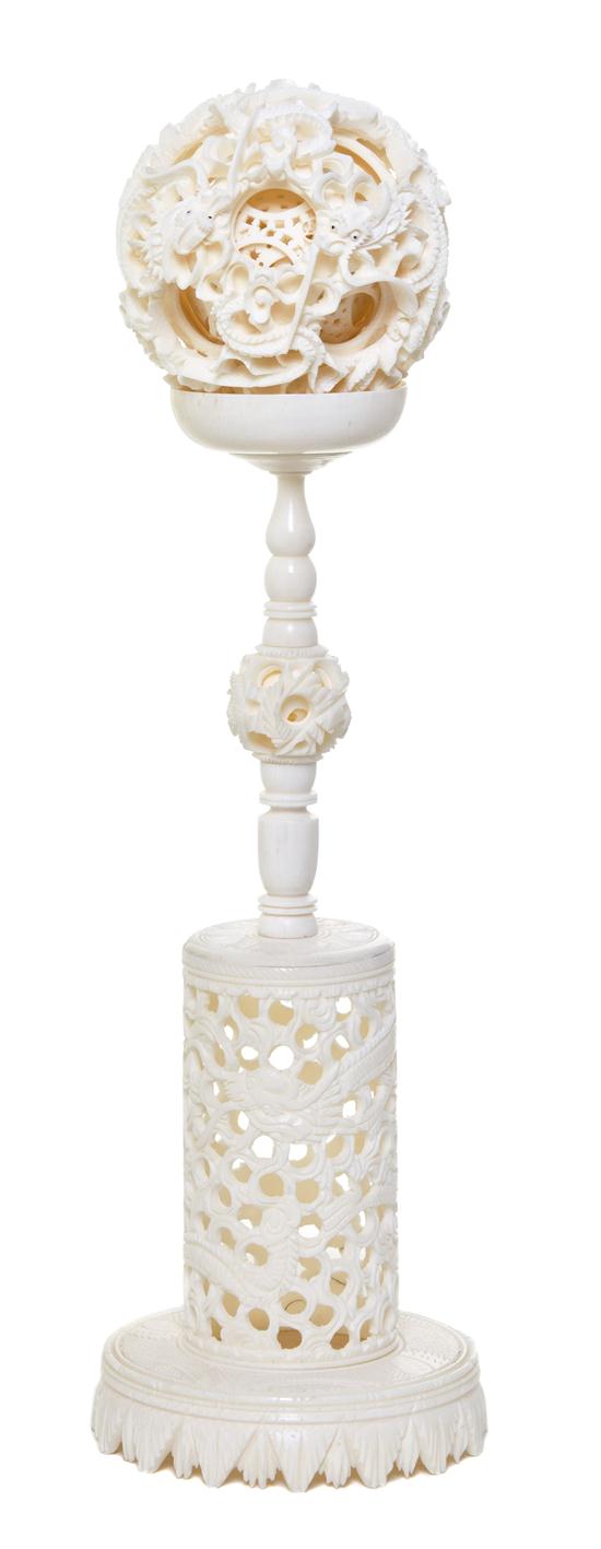 A Carved Ivory Puzzle Ball on Stand