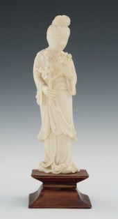 A Carved Ivory Quan Yin Holdin
