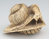 A Carved Ivory Snail Netsuke A