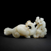 A CARVED JADE BIRD AND BOY ORN