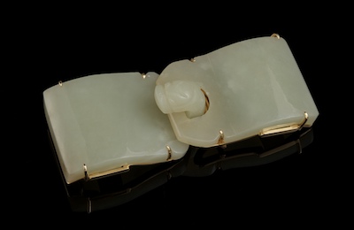 A Carved Jade Buckle Set as a