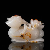 A CARVED JADE DECORATION OF MA