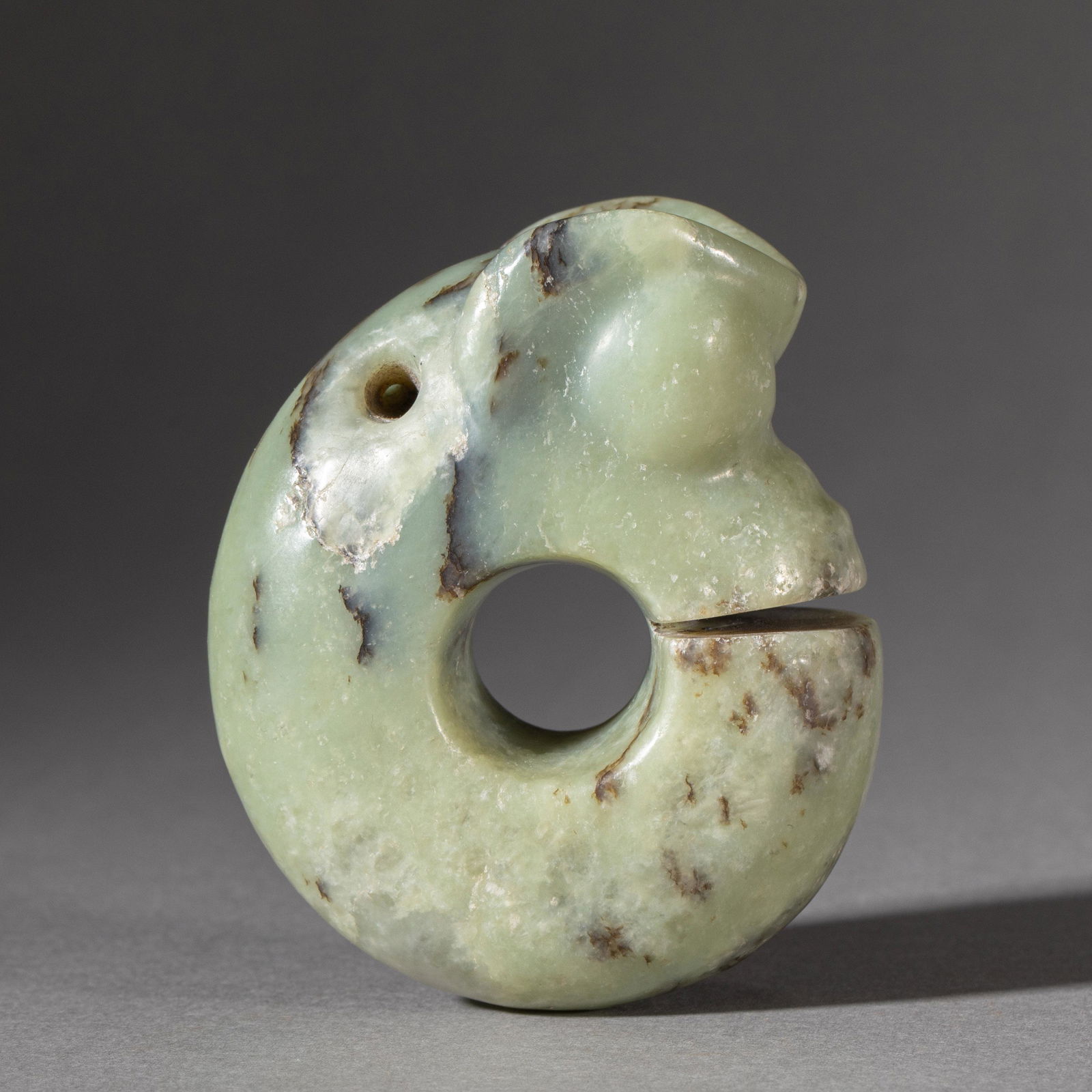 A CARVED JADE DRAGON PENDANTA