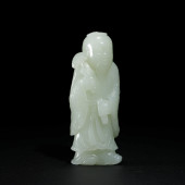 A CARVED JADE FIGURE ORNAMENTS