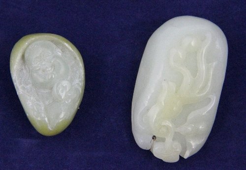A carved jade gourd and another