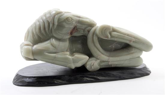 A Carved Jade Horse of celadon