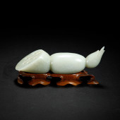 A CARVED JADE LOTUS ROOT<br>A