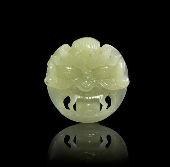 A Carved Jade Mask Form Belt Buckle