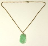 A carved jade pendant of gourd
