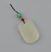 A Carved Jade Pendant Of ovoid