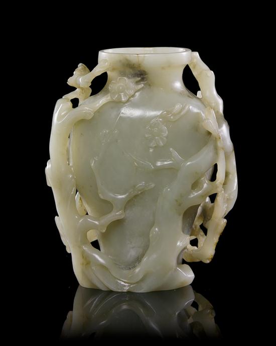 A Carved Jade Vase of pale
