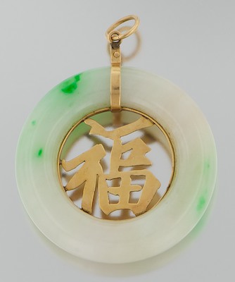A Carved Jadeite and Gold Pendant