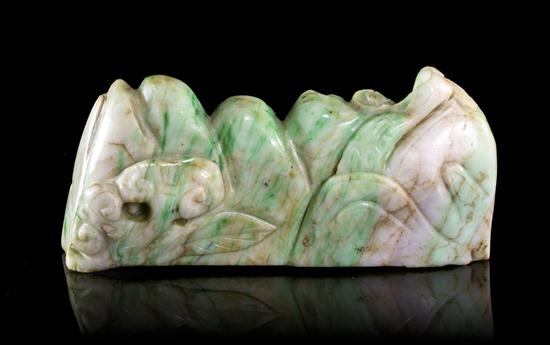 A Carved Jadeite Brush Rest of
