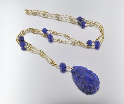 A Carved Lapis and Gold Necklace