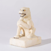 A CARVED MARBLE FELINE<br>A CA