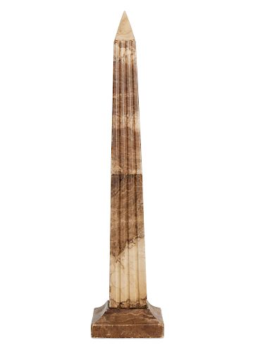 A CARVED MOTTLED BROWN ALABASTER