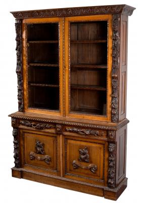 A carved oak bookcase with