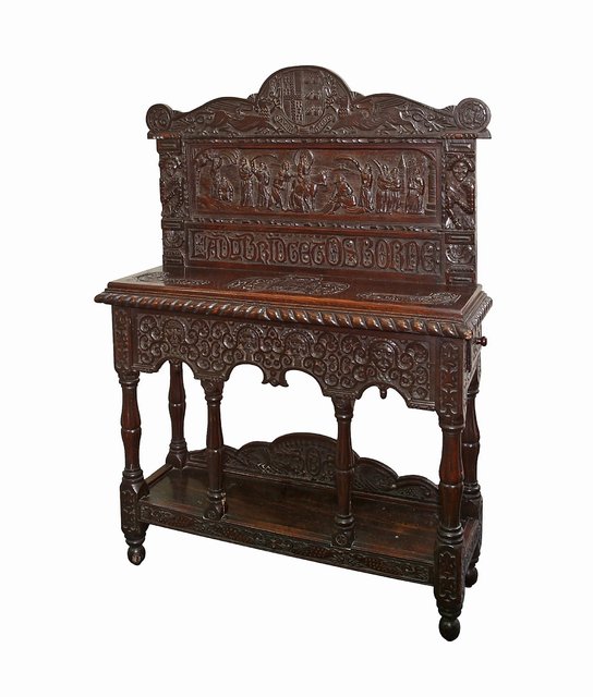 A carved oak credence table of 17th