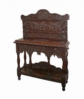 A carved oak credence table of