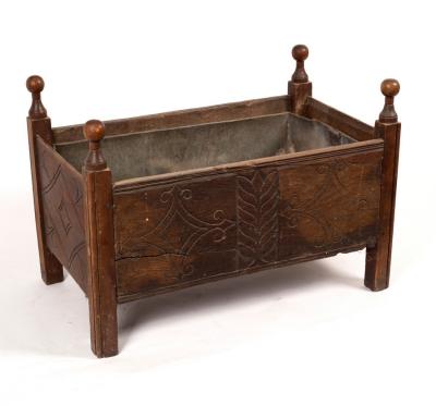 A carved oak log box, part 17th