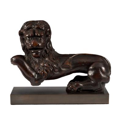 A carved oak model of a lion,