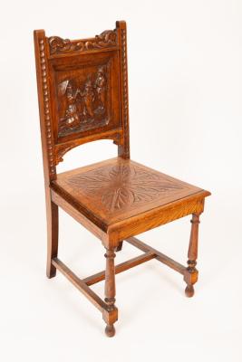 A carved oak single chair, the back