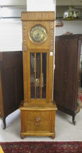 A CARVED OAK TALL CASE FLOOR C