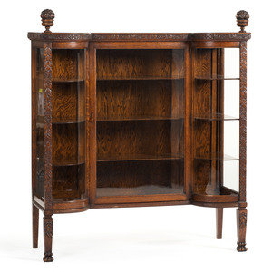 A Carved Oak Vitrine Cabinet and