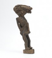 A Carved Protective Figure Lom