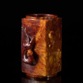 A CARVED RUSSET JADE CONG<br>A
