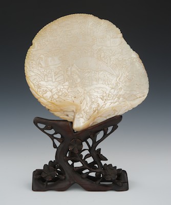 A Carved Sea Shell with Ornate Wood