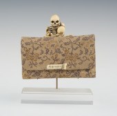 A Carved Skeleton Mounted Toba