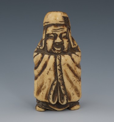 A Carved Staghorn Netsuke of