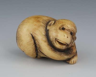 A Carved Staghorn Netsuke of a Baby
