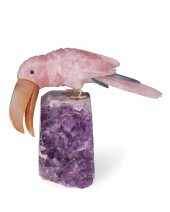 A CARVED STONE TOUCAN FIGURE A
