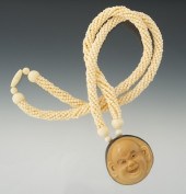 A Carved Tagua Nut and Ivory B