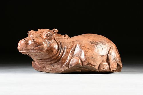 A CARVED TEAK BABY HIPPOPOTAMUS,
