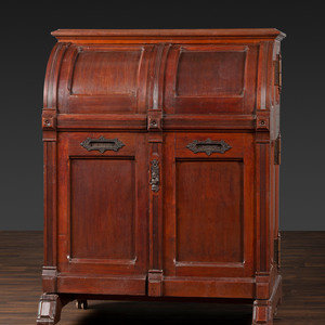 A Carved Walnut Wooton Secretary