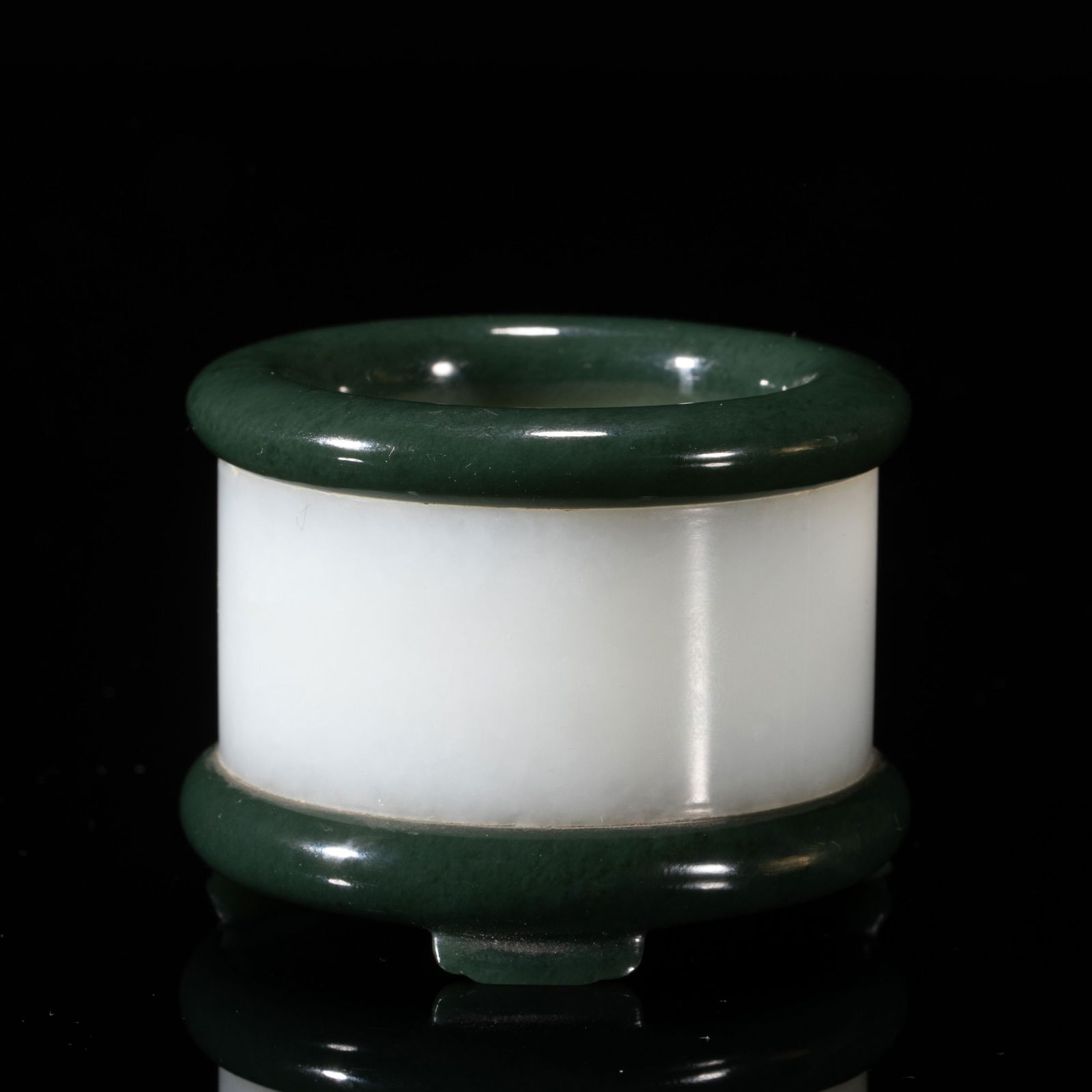 A CARVED WHITE AND SPINACH GREEN