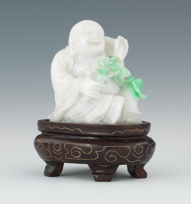 A Carved White Jade Buddha with